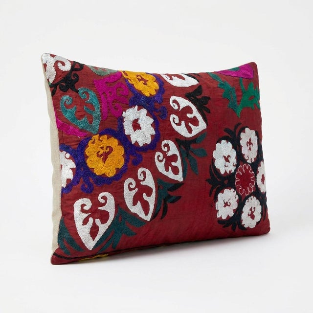 This beautiful 20'' x 28'' hand-embroidered Suzani pillow cover was made from authentic Uzbek cotton fabric. The intricate...