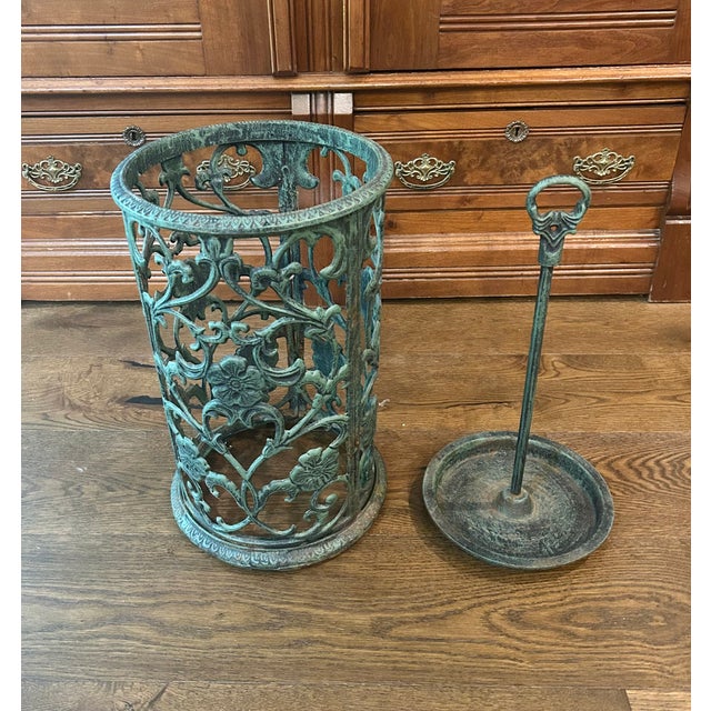 Sturdy iron umbrella or walking stick stand with forged antique floral vine and flower pattern and finished in a historic...