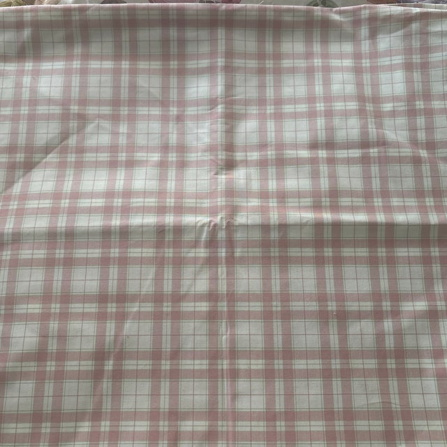 100 inches of Laura Ashley fabric that appears to be cotton and it’s a sturdy fabric that could be used for light...