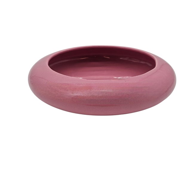 Like a memory pressed in plum velvet, this squat ceramic form murmurs the modern quiet of a mid-century home—ashtray...