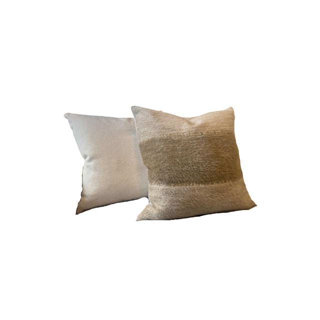 Decorative accent pillows featuring a textured striped pattern in a warm browns and beige. - 10% down / 90% feather blend