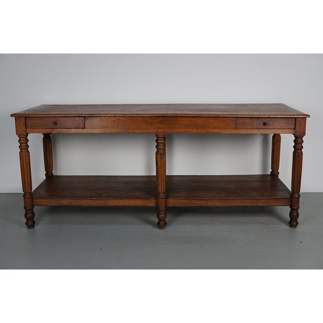 This elegant table was made in France in the 19th century. It has a tabletop from solid oak with beautiful grain patterns....