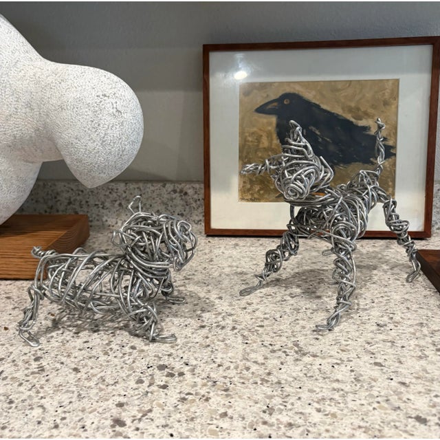 These adorable dogs were hand made by listed artist Christopher (Cyrstofer) Shoemaker (American b. 1969) who is self...