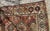 Handmade antique Caucasian Kazak rug in red color. The rug is from the end of 19th century in distressed condition....