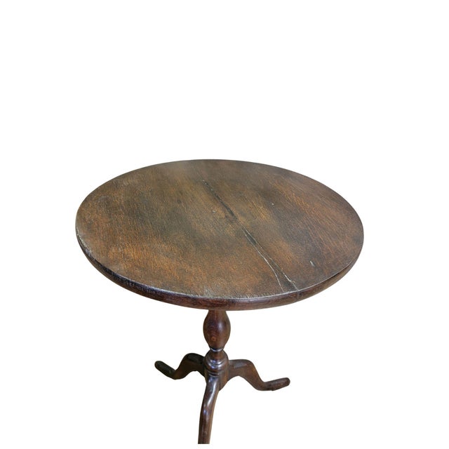 A simple utilitarian Tri-pod table made of Oak.