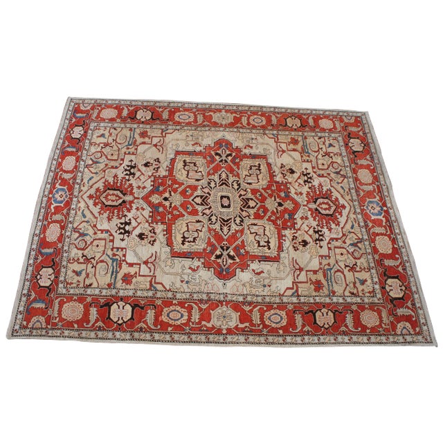 Vintage Persia Revisited Heriz area rug carpet. Features a field of tan / ivory / beige with a central medallion and...