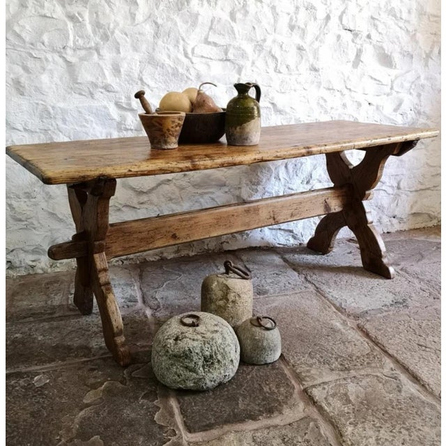 Antique rustic tavern table from the beginning of the 18th century. Made with a removable X-shaped base making completely...