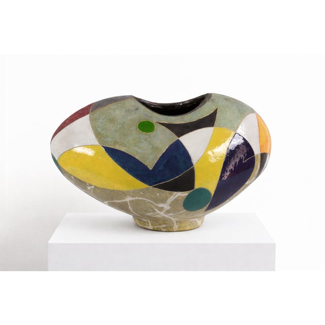 Low, wide, and quietly confident, this vessel feels like it has found its natural resting shape. The surface is divided...