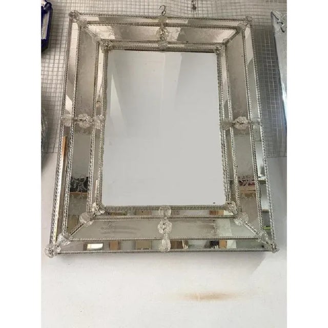 Spectacular mirror with Murano glass transparent flowers and leaves. Rectangular mirror with venetian hand-carved floreal...