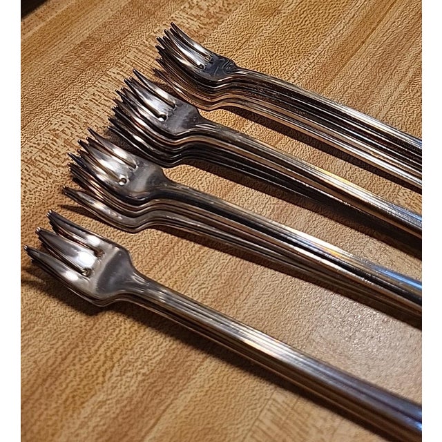 Estate find of new old stock. Vintage Oneida Hotel Plate oyster or cocktail forks were produced over a wide span of the...