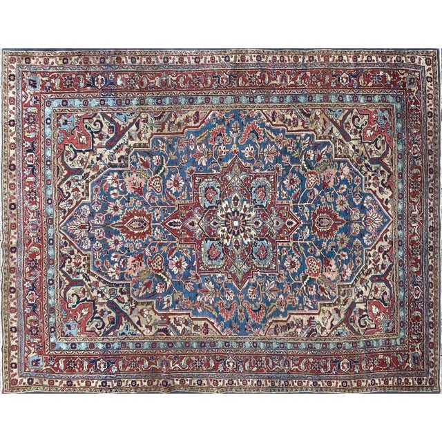 Antique Persian Heriz/Serapi, hailing from the Iranian province of Eastern Azerbaijan and the encompassing Heriz region,...