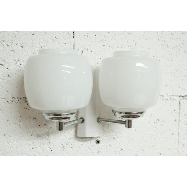 Targetti Sankey double wall light, made in Italy, in white metal, chrome, and white opaline glass. The opaline glass...