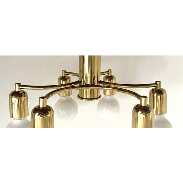 Elegant 1970s german hollywood regency style ceiling light in polished brass-finished metal, featuring six light points....