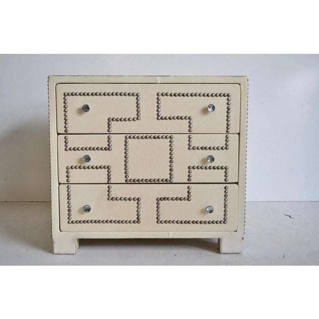 Vintage Hollywood Regency Studded Faux Leather Nightstand Table Campaign Chest. Item features faux leather wrapped wooden...