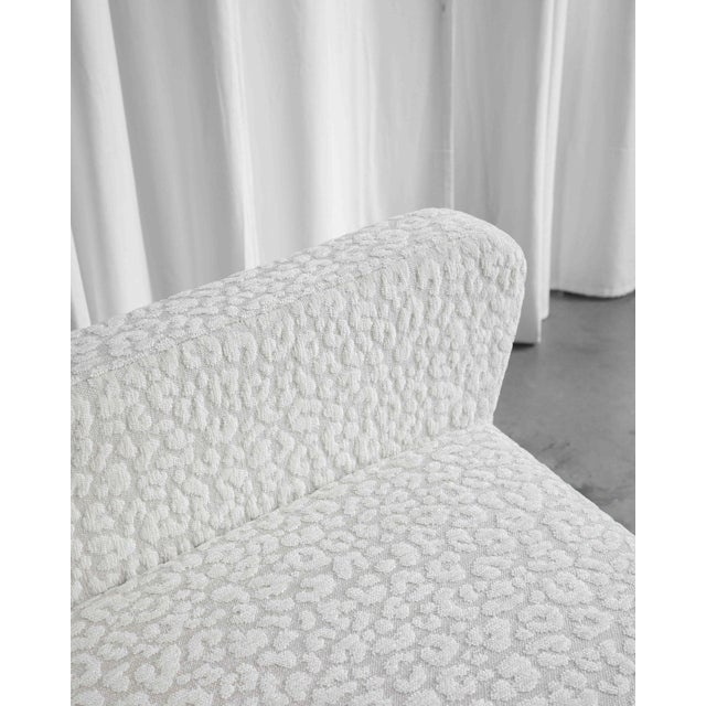 Italian armchair from the 1950s, fully renovated. Upholstered in high-quality off-white fabric with a leopard pattern....