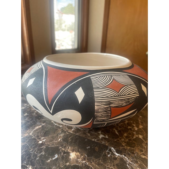 Contemporary Native American Pot from the Ysleta Del Sur Pueblo Tiqua Tribe. By Gloria Holguin, 1984. Artist mark. Pot...