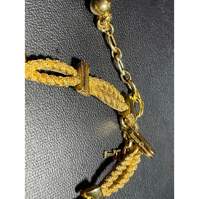 Exquisitely crafted Crown Trifari choker seamlessly blends the fluid, organic aesthetic of twisted rope with the enduring...