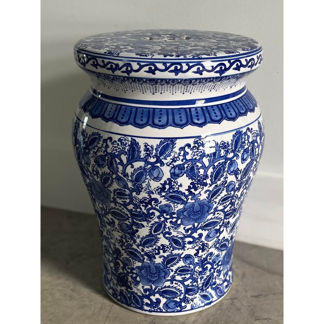 A versatile piece in classic delft inspired blue and white. An indoor/outdoor table or seat decorated in floral vines.