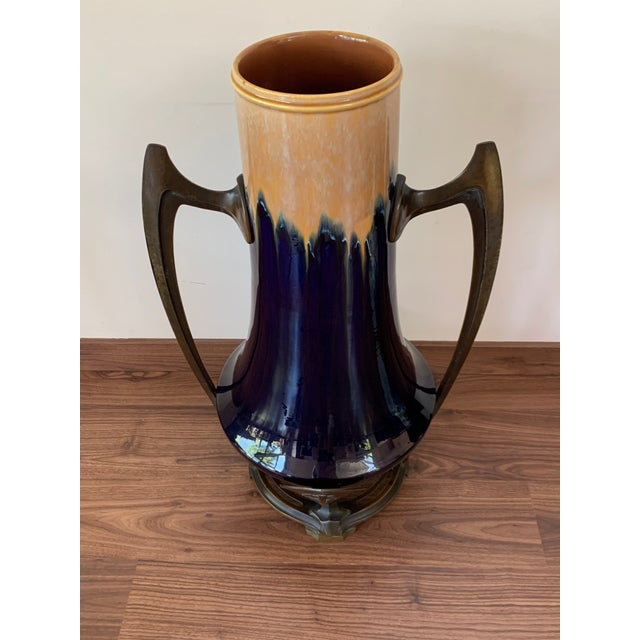 About Jugendstil ceramic vase bronze mounted is an original decorative object realized in the early 20th century. Original...