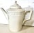 This German KPM Berlin Kurland “Blanc Nouveau" white porcelain coffee/tea set features a classicist relief design in a...