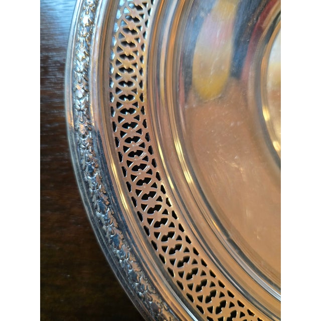 This is a light weight sterling silver tray with exquisite leaf pattern pierce work and lattice design. This would be a...