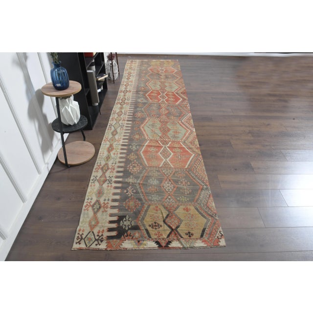 Vintage Turkish Hand-Knotted Kilim rug is a semi-antique vintage area rug. The '70s Eastern region of Anatolian's unique...