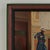 Intriguing 19th century oil painting on board depicting a well dressed lamplighter pouring oil into a lamp within a richly...