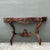 This exquisite vintage demilune console table is a masterclass in hand-carved artistry, drawing deep inspiration from the...