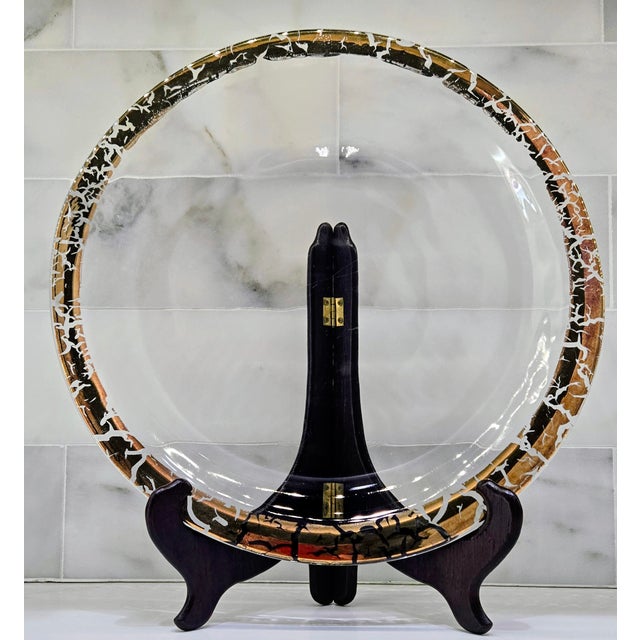 This vintage 14" glass charger is designed to command attention at the center of a table, console, or buffet, with its...