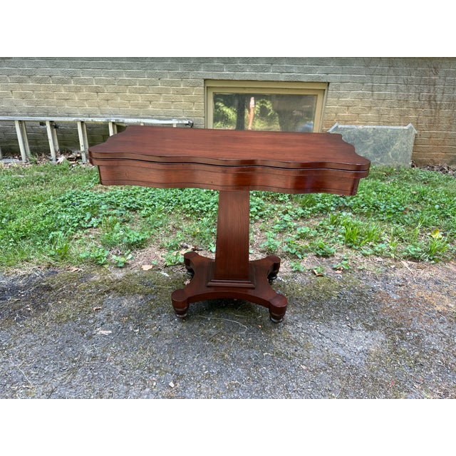 Antique Regency Style Mahogany Flip Top Game Table Antique Mahogany Foldable Game Table with Scalloped Edge on Casters...