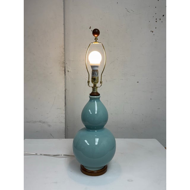 Design Plus Gallery presents a Ceramic Table Lamp from Ralph Lauren. This sculptural lamp showcases a classic double gourd...