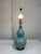 Design Plus Gallery presents a Ceramic Table Lamp from Ralph Lauren. This sculptural lamp showcases a classic double gourd...