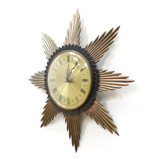 Mid century sunburst clock by 'Metamec'. Produced in the 1960s this beautiful clock is typical of the period, made from...