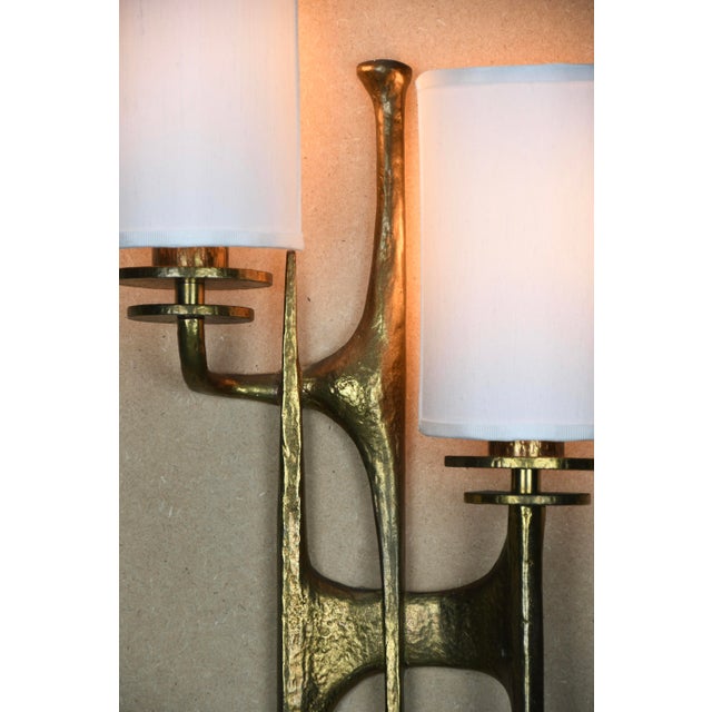 Pair of sculptural brutalist bronze wall sconces attributed to félix agostini, france, mid-century modern a striking and...