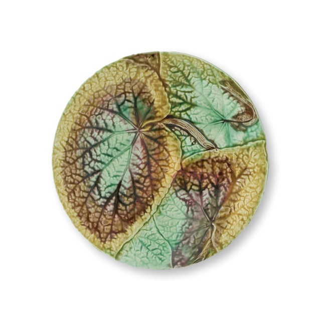 Set of three antique English majolica plates, mid to late 19th century, featuring bold begonia leaves in rich shades of...
