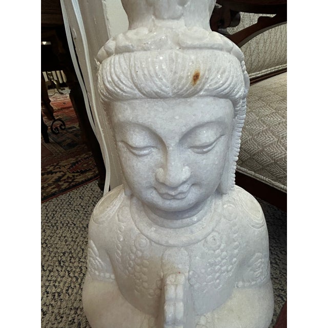 Impressive hand carved white marble Guanyin Bodhisattva statue in a meditative prayer position. Can be displayed indoors...