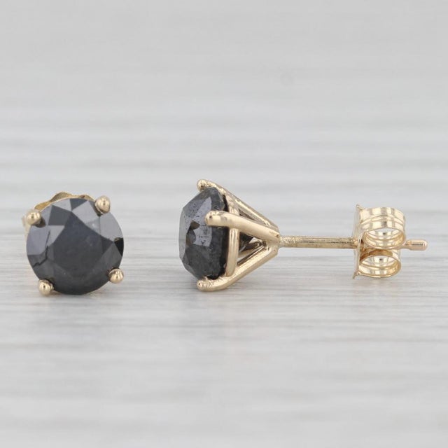Gemstone Information: - Natural Diamonds - Total Carats - 2.25ctw Cut - Round Brilliant Color - Black Metal: 14k Yellow...