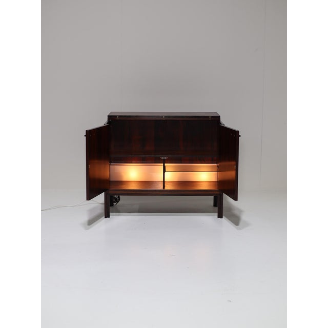 This elegant bar cabinet was produced in the 1960s by Feldballes Møbelfabrik in Denmark and is crafted in beautifully...