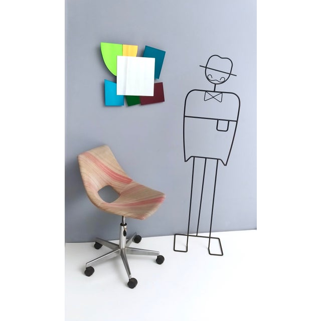 Made with different colored mirrors, wood and metal. Limited production. This mirror is in excellent original condition...