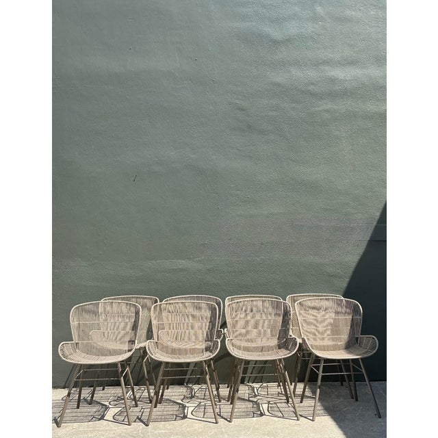 This sophisticated set of eight "Rose" dining chairs showcases the perfect marriage of industrial strength and airy,...