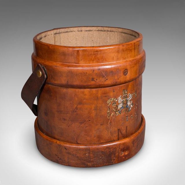 This is a vintage drawing room waste paper basket. An English, leather study or home office bin, dating to the mid 20th...