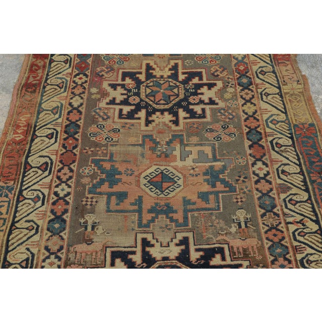 Hand-knotted in wool circa 1870–1900, this 3x5 antique Zeichour rug is a collectible example of Caucasian weaving,...