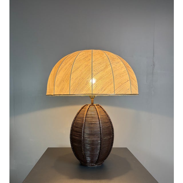 Lovely pencil reed rattan lamp with mushroom shade generally attributed to Italy, 1970s-1980s. The shade although period...