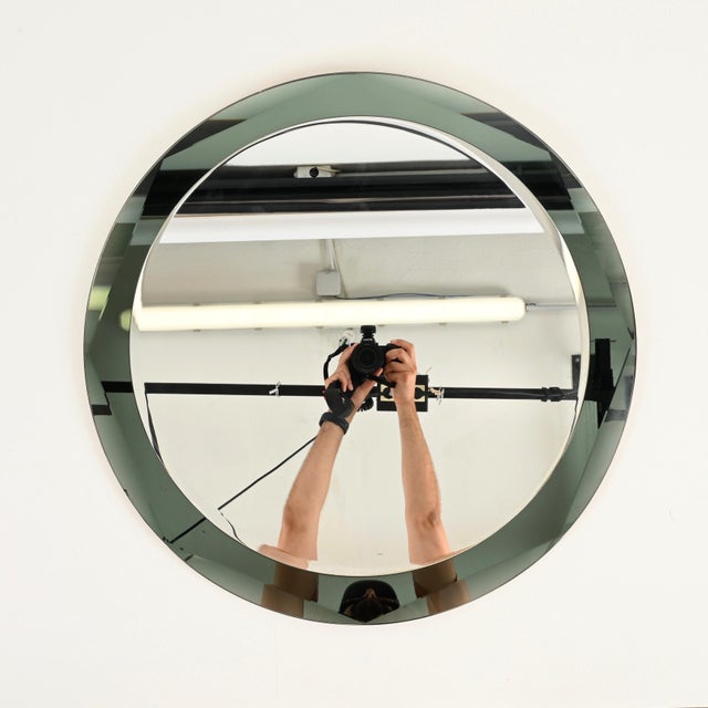 Marvelous and rare round double-beveled mirror designed by Antonio Lupi and produced by Cristal-Luxor in Italy during the...
