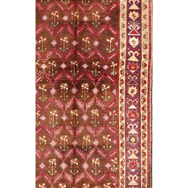 Measures: 4'5 x 9'9 Vintage Turkish Oushak Gallery Runner with Deep Chestnut and Soft Red 4'5 x 9'9. Keivan Woven Arts /...