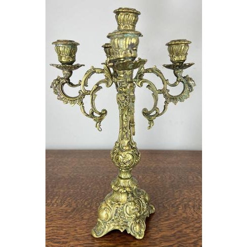 This elegant Vintage French candelabra is a richly decorative table piece, featuring an ornate five-arm design with...