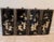 A decorative set of four vintage mid 20th century black lacquer wall panels featuring hand-carved pastel mother-of-pearl...