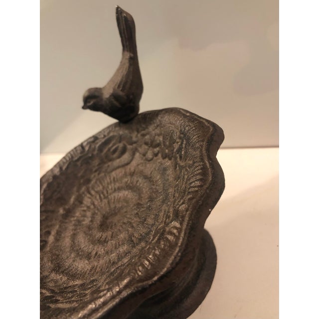 This eye-catching Vintage Cast Iron Bird Bath Decorative Bowl on Pedestal is a charming, versatile and functional addition...