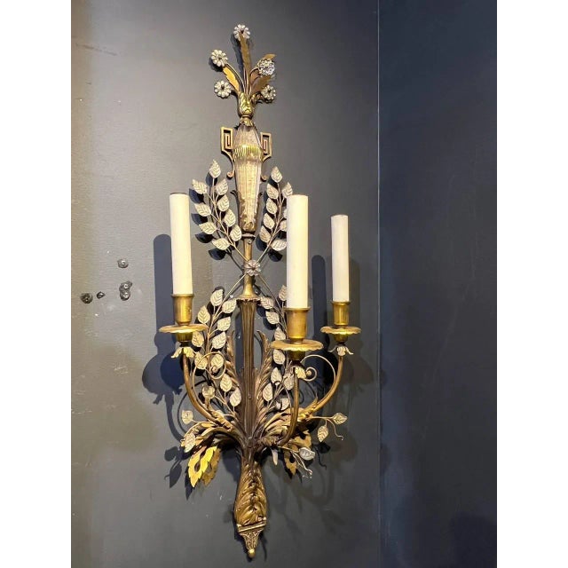 A circa 1900's Caldwell sconces with three lights and glass leaves and glass urn body on top