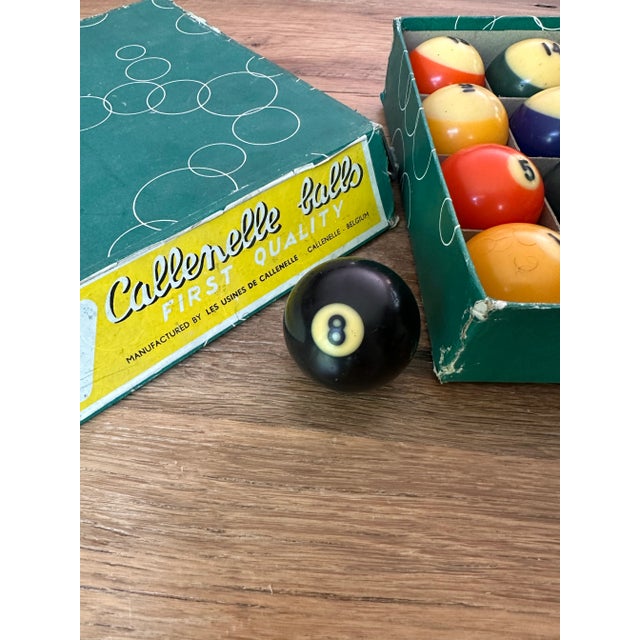 Complete set of vintage pool/billiard balls in original box. Signs of age and use-discoloration and scuff. Excellent to...